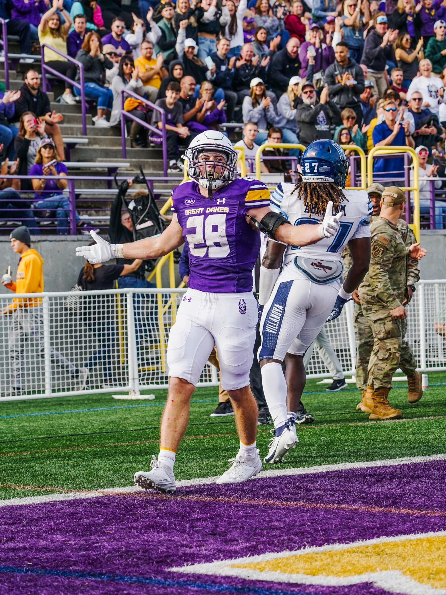 Celebrating on the field at a UAlbany football game